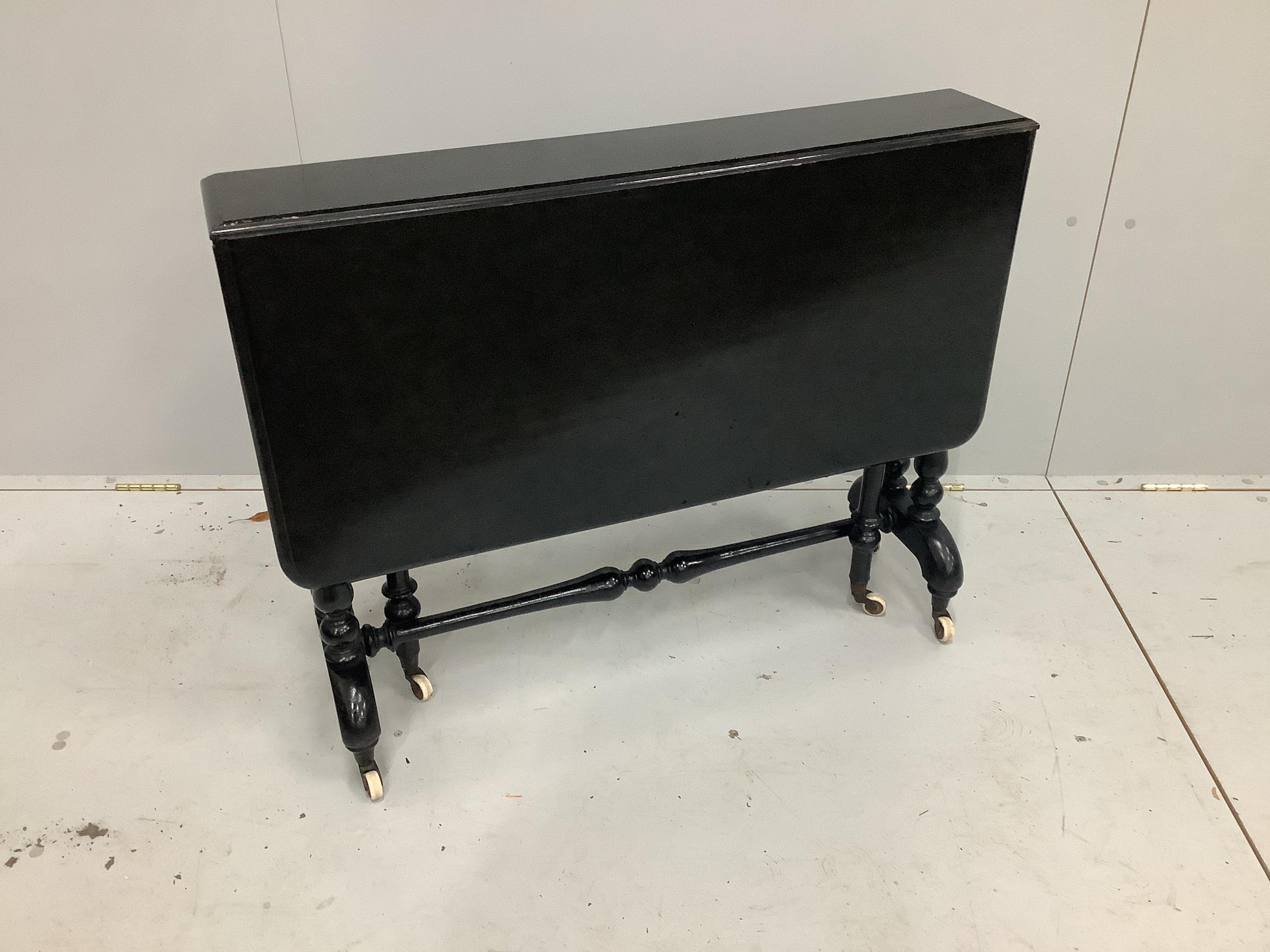 A 19th century ebonised Sutherland table, width 90cm, depth 17cm, height 72cm